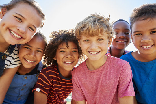 Group of diverse smiling children together outdoors
