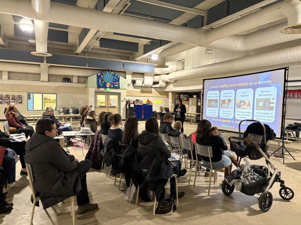 Jenna Poste presenting about healthy tech habits at a school community event